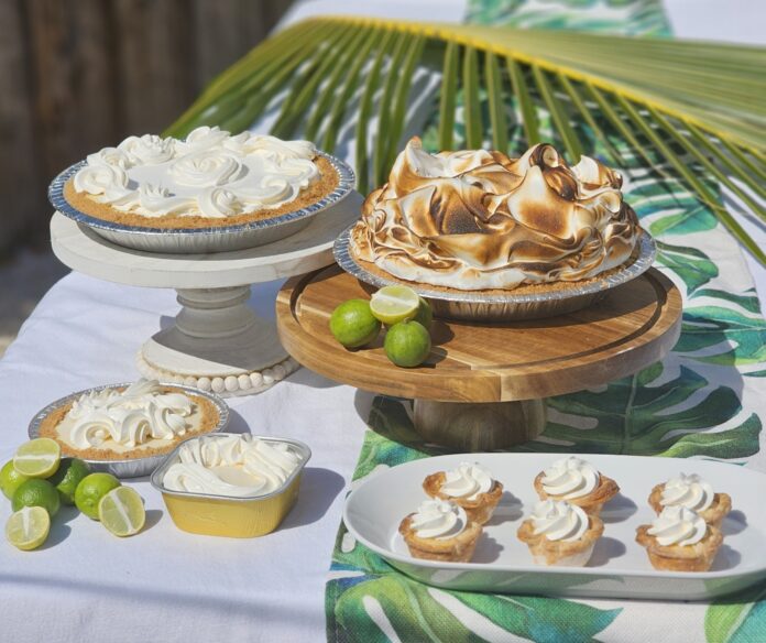a table topped with pies and other desserts