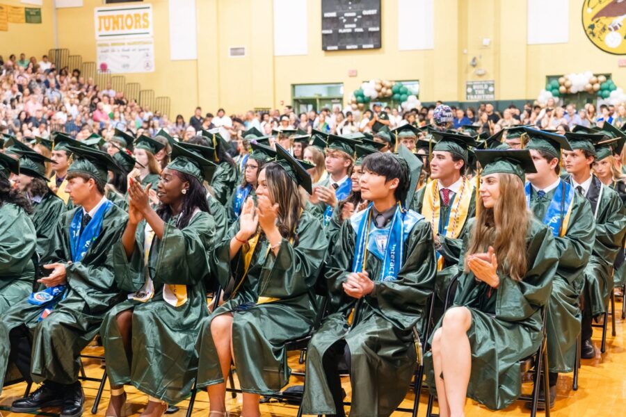 a large group of people in graduation gowns