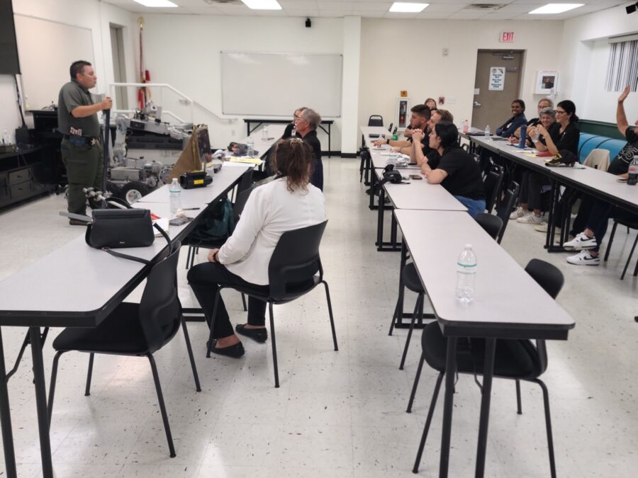 a group of people sitting at tables in a room