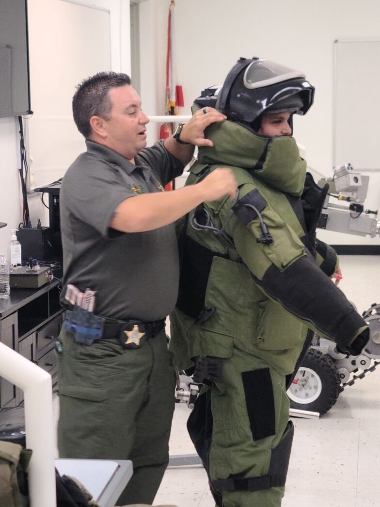 a couple of men standing next to each other in a room