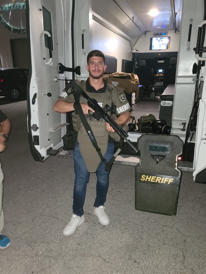 a couple of men standing next to each other