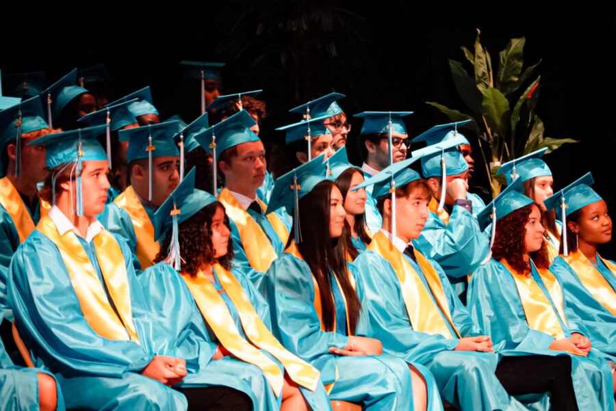 a group of people in graduation caps and gowns