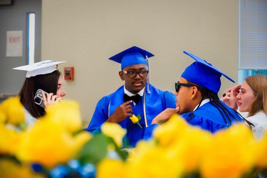 a group of people in graduation caps and gowns