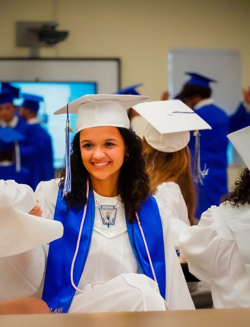 a group of people in graduation caps and gowns