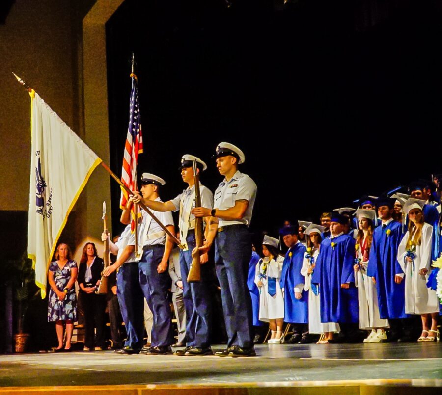 a group of people standing on top of a stage