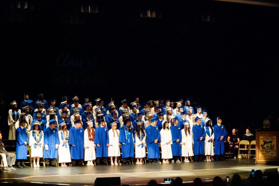 a group of people standing on top of a stage