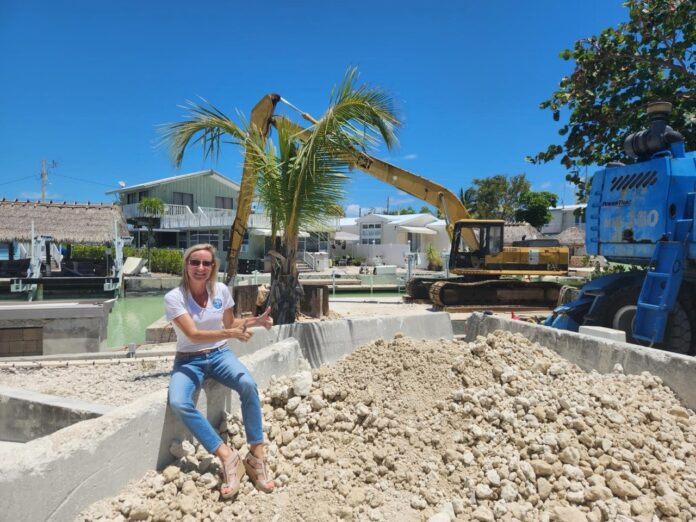 a woman sitting on a pile of dirt