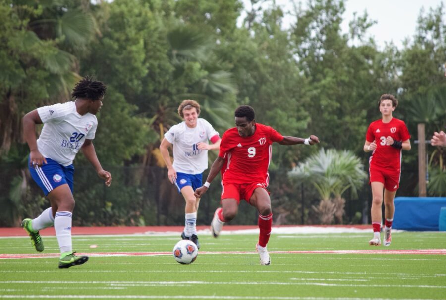 a group of young men playing a game of soccer