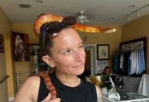 a woman with a snake on her head