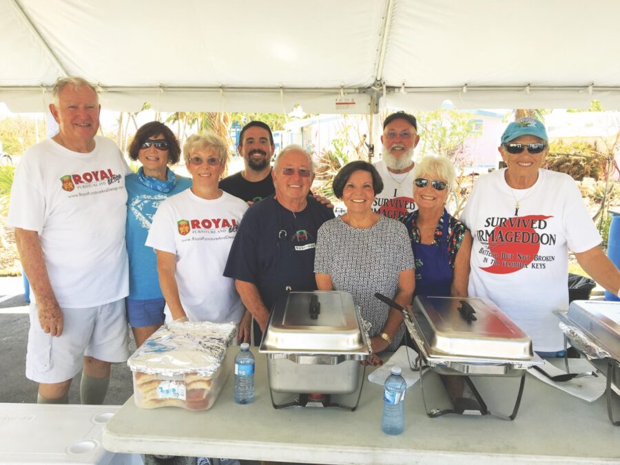 a group of people standing under a tent