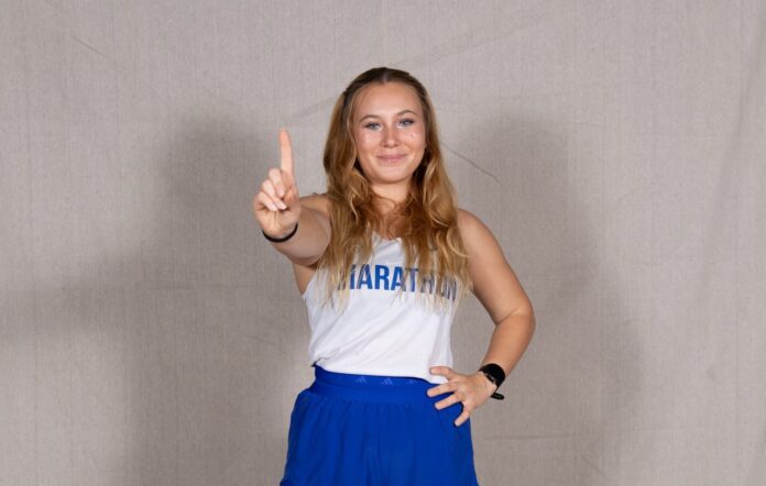 a woman is posing for a picture with her finger up