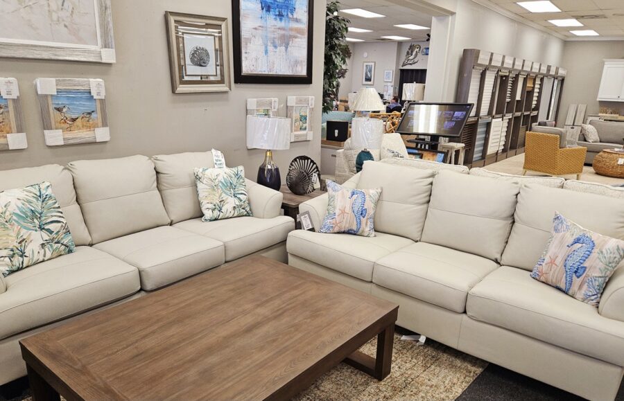 a living room filled with furniture and a coffee table