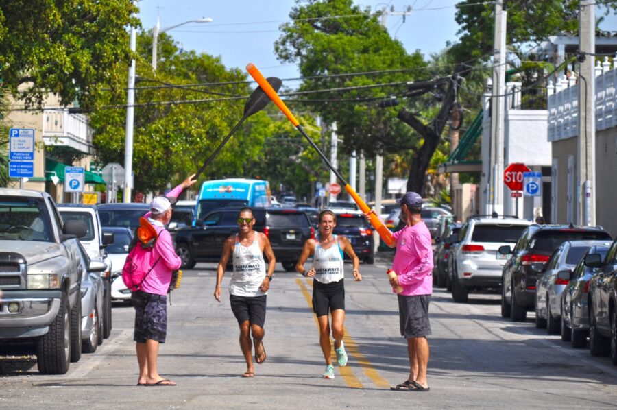 a group of people walking down a street