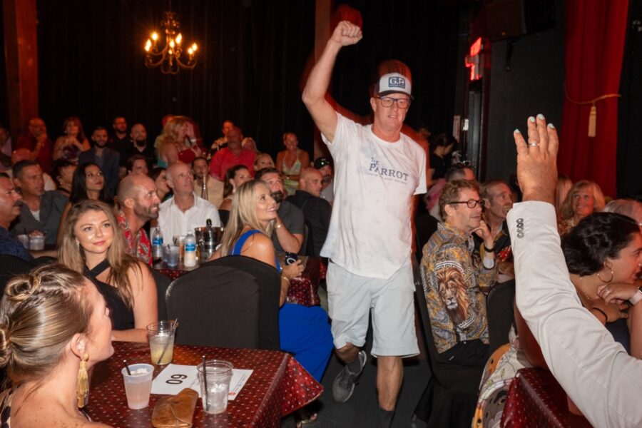 a man standing in front of a crowd of people