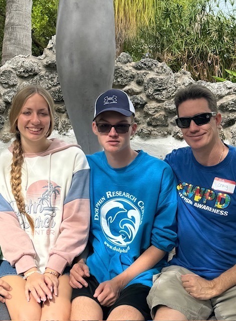 a group of people sitting next to each other