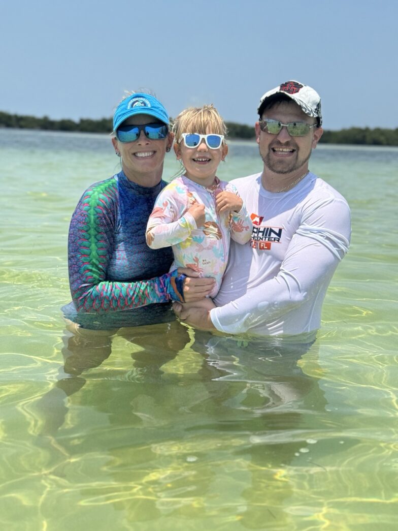 a man and two children are in the water