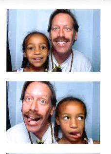 a man and a little girl posing for a picture