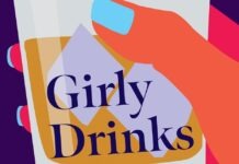 a hand holding a drink with the words girly drinks on it