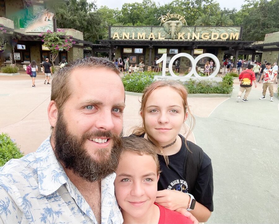 a man and two children posing for a picture