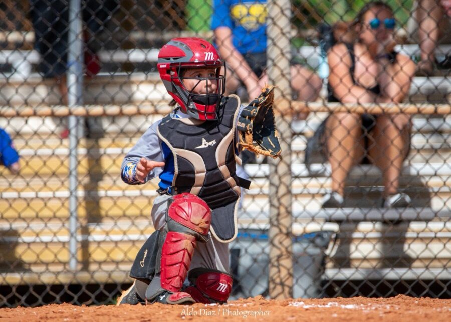 a baseball player swinging a bat at a ball