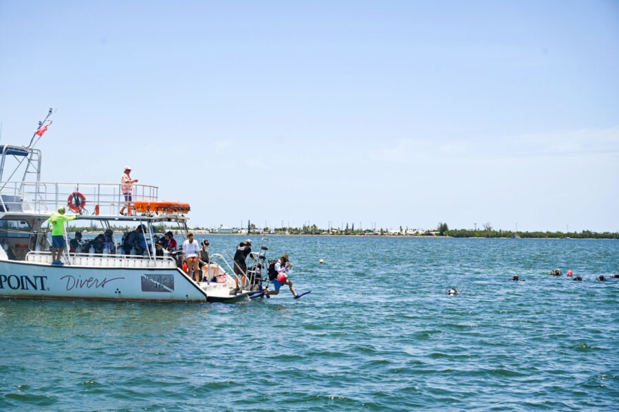 a group of people on a boat in the water