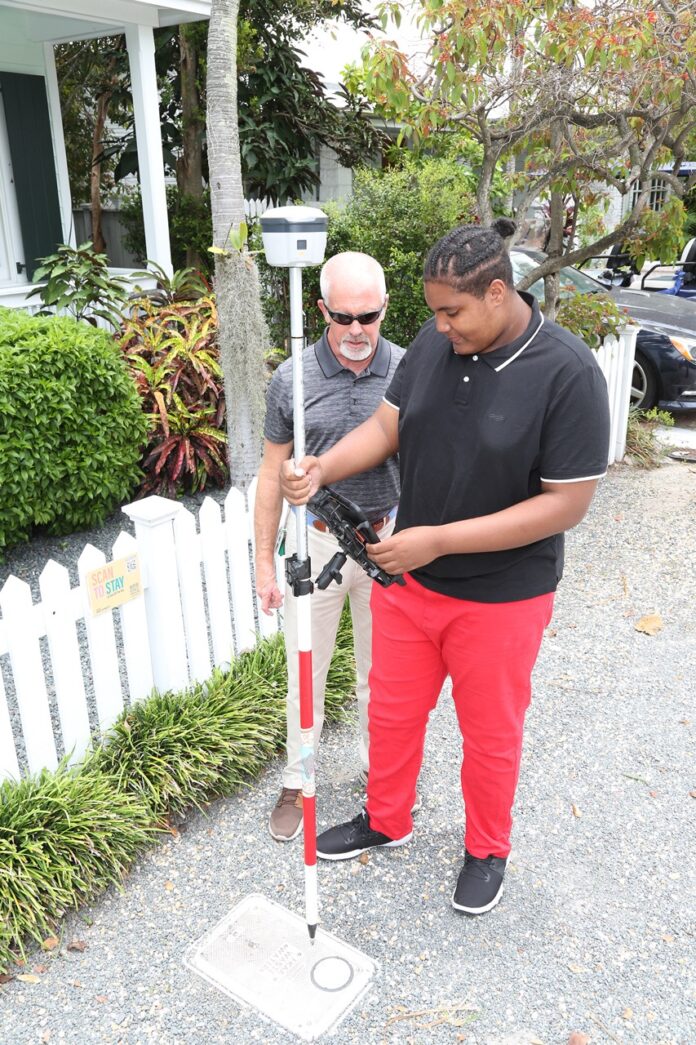 a couple of men standing next to each other