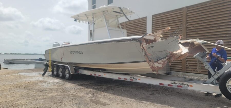 a boat being loaded onto a trailer