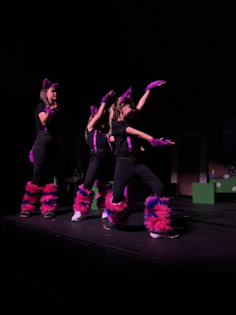 a group of people that are standing on a stage