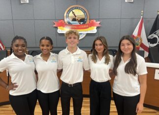 STUDENT VOICES RISING: MONROE COUNTY SCHOOLS HAVE NEW LEADERSHIP PROGRAM a group of young people standing next to each other