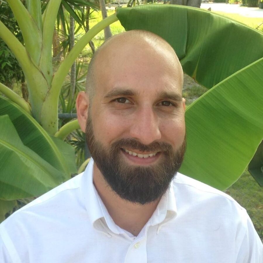 a man with a beard and a white shirt