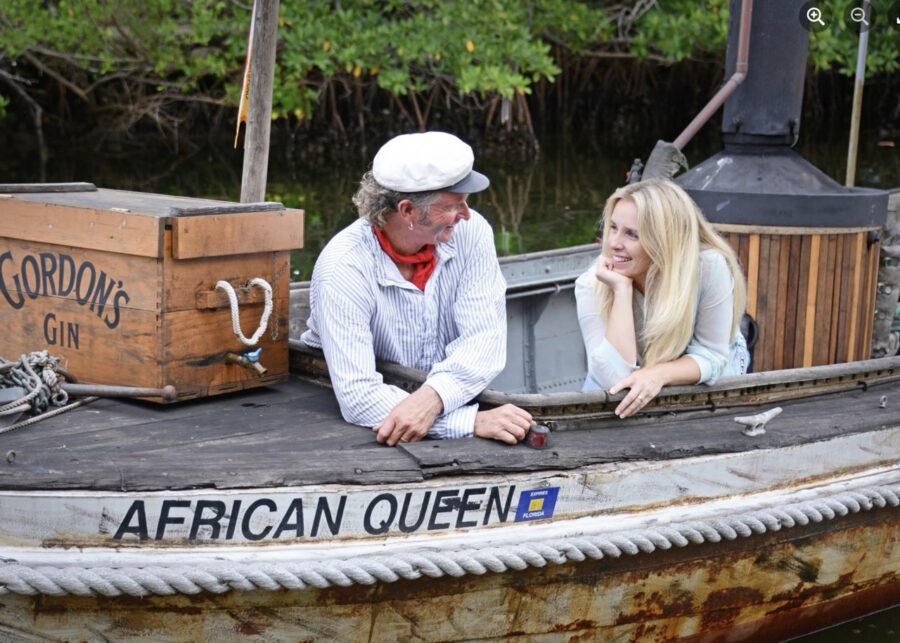 a man and a woman sitting in a boat