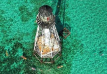 a light house in the middle of the ocean