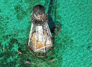 a light house in the middle of the ocean