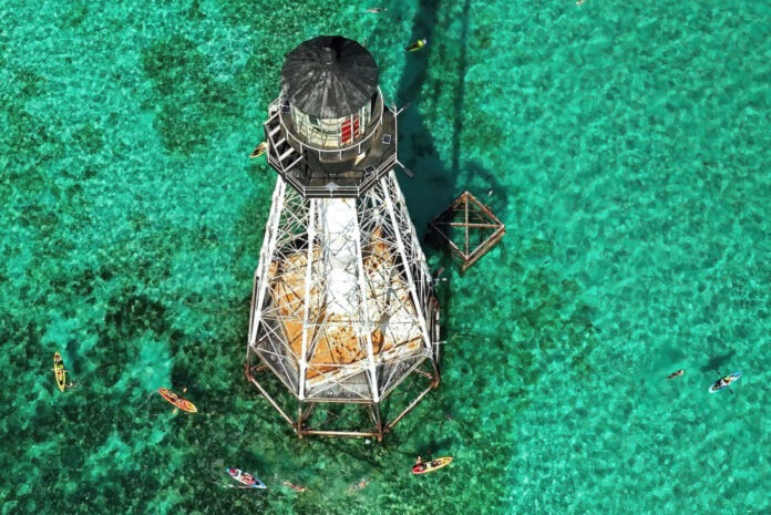 a light house in the middle of the ocean