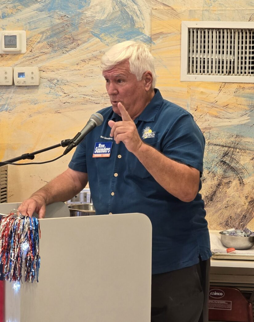 a man standing at a podium giving a speech