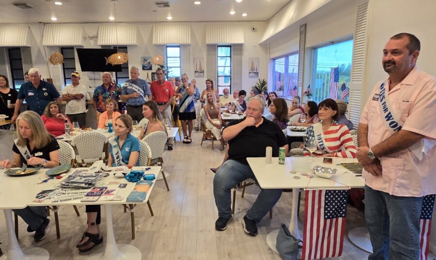 a group of people sitting at tables in a room