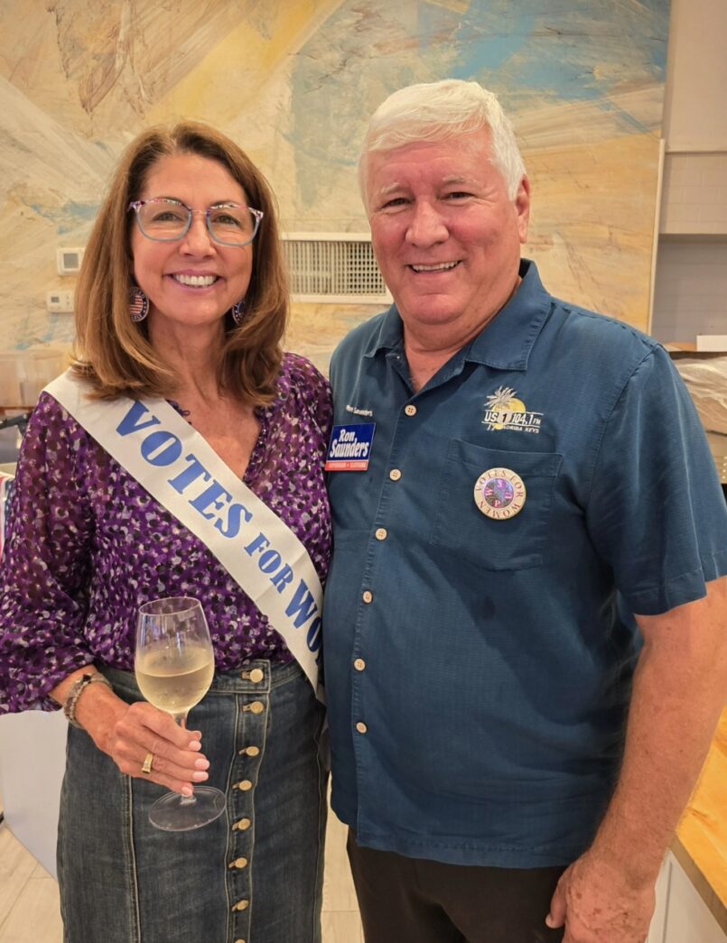 a man and a woman standing next to each other