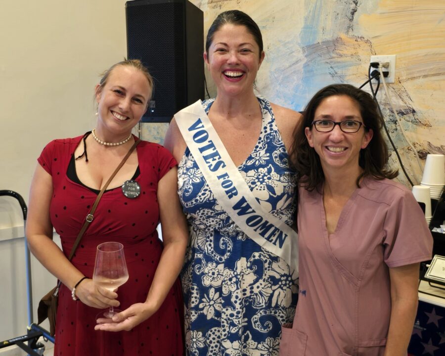 a group of women standing next to each other