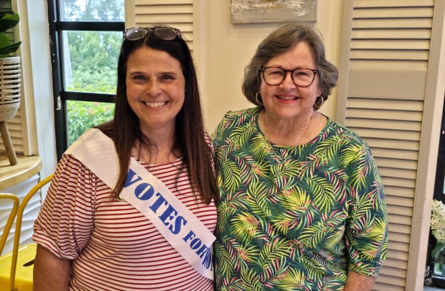 a couple of women standing next to each other