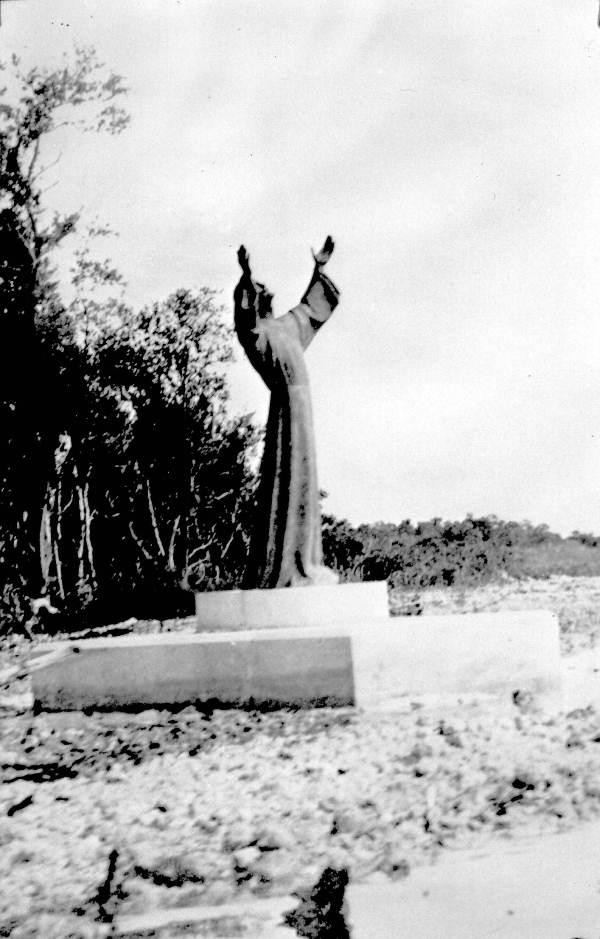 a black and white photo of a statue