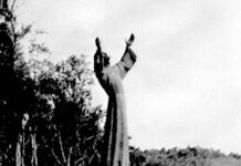 a black and white photo of a statue