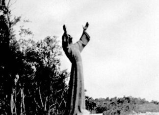 a black and white photo of a statue