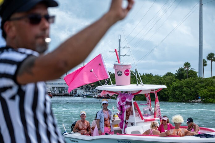 a group of people on a boat in the water