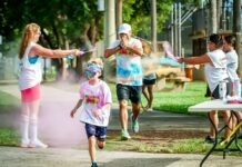 a group of people running in a park