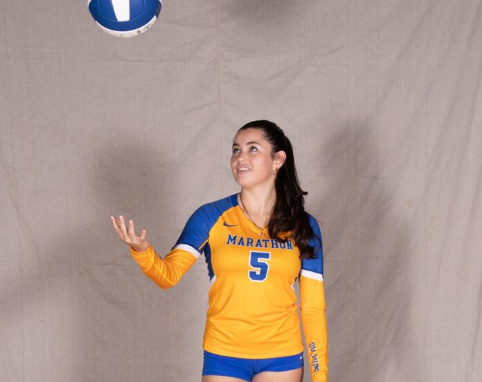 DSC_0644 a female volleyball player is posing for a picture