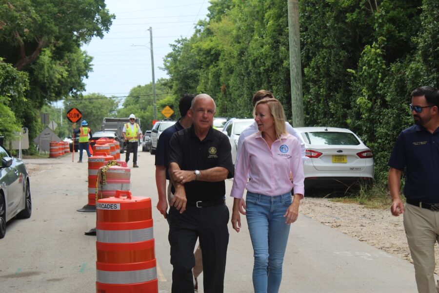 a man and a woman walking down a street