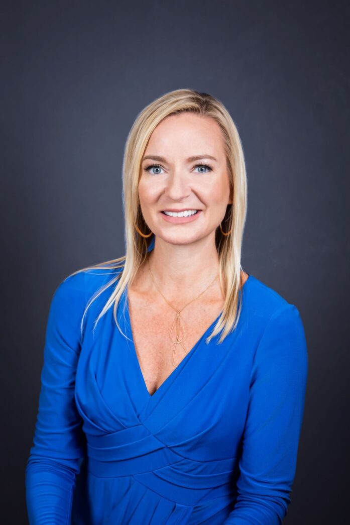 a woman in a blue dress posing for a picture