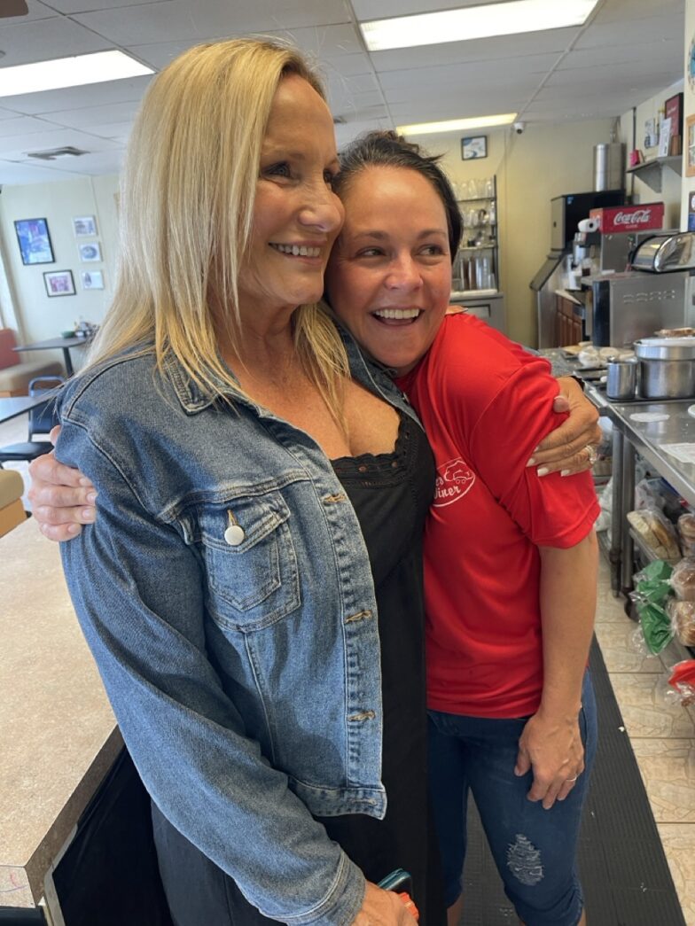 a couple of women standing next to each other