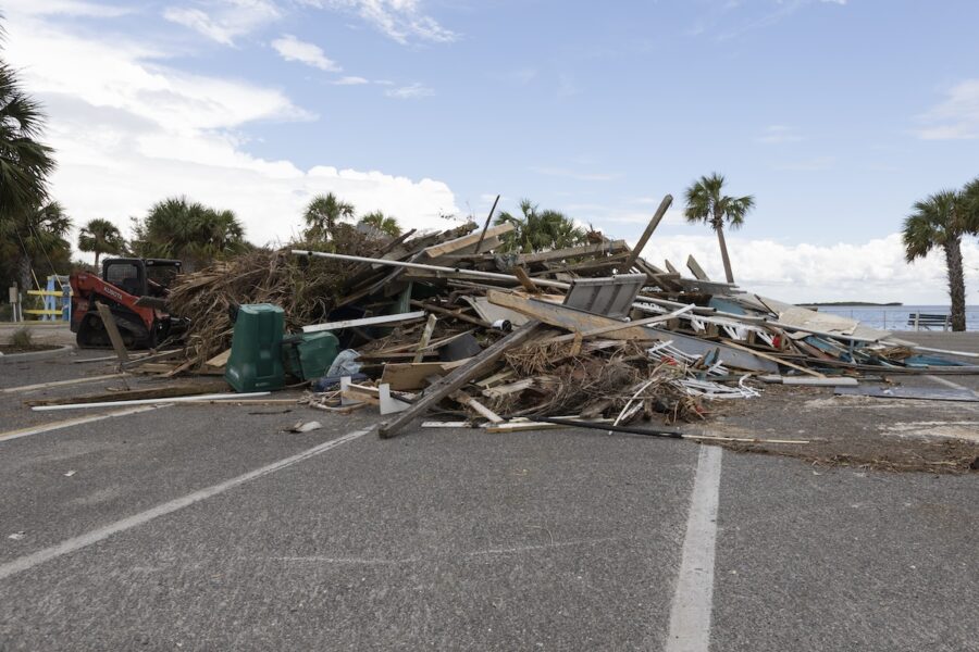 a pile of debris sitting in the middle of a parking lot