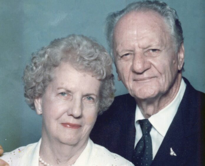 a man and a woman posing for a picture